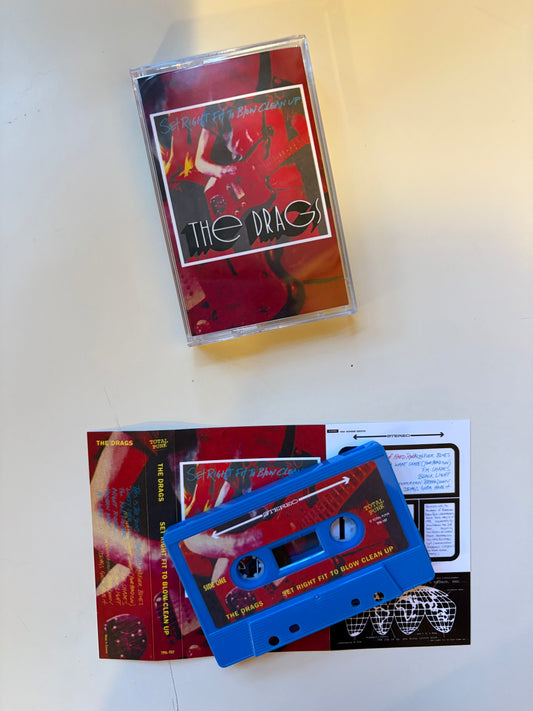 Cassette tape with colorful cover and manual on a white surface