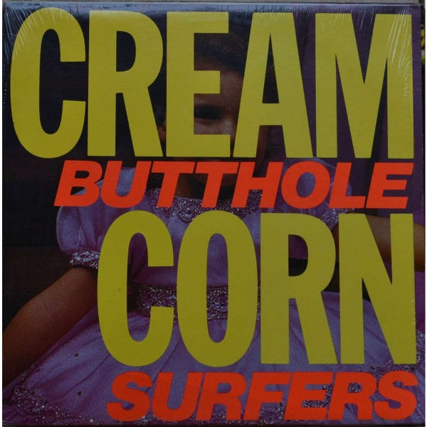 A little girl in a pink dress with the words CREAM BUTTHOLE CORN SURFERS in front of her