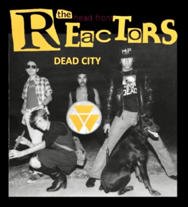 Album cover for 'Dead City' by the band 'the Reactors'. The black-and-white photo features four band members and a black dog, with the band's name in large yellow font at the top and a yellow triangle logo in the center.