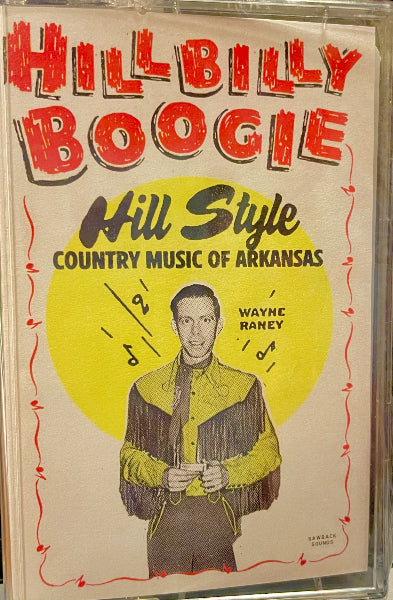 A vintage printed cover or poster reading 'Hillbilly Boogie' and 'Hill Style Country Music of Arkansas' with 'Wayne Raney' pictured in a cowboy outfit, framed inside a clear plastic sleeve.