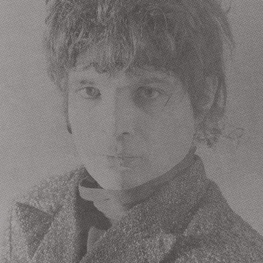 Black and white portrait of a person with textured clothing