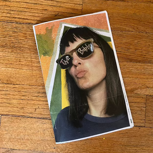 Emily Robb wearing sunglasses with The Bible written across them
