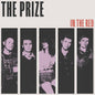 Five thin black bars with images of each band member in purpler with THE PRIZE IN BOLD BLACK LETTERS ABOVE