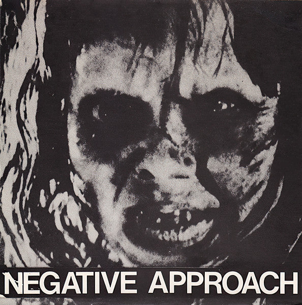 Black and white album cover with a face-like design and 'Negative Approach' text.