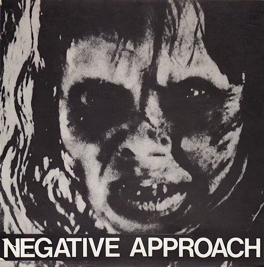 Black and white album cover with a face-like design and 'Negative Approach' text.