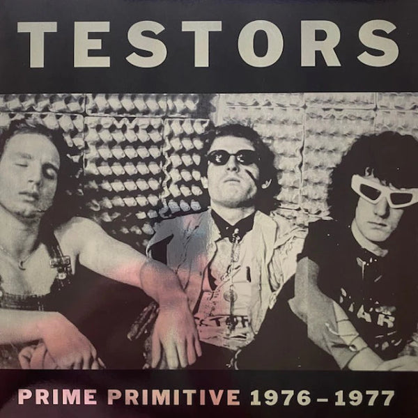 The band sitting in the studio