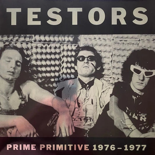 The band sitting in the studio