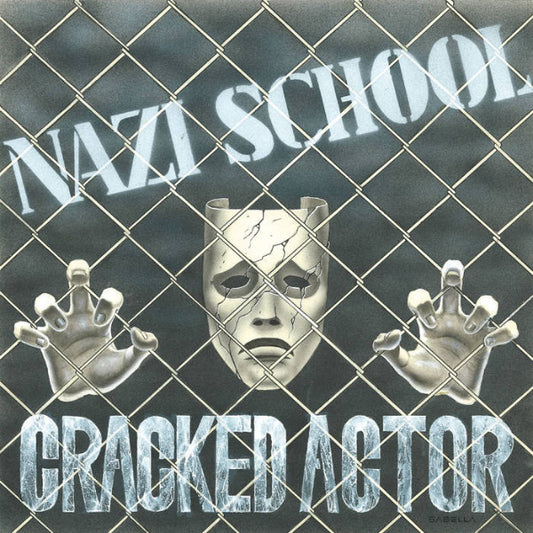 Album cover with a mask, hands, and text 'Nazi School Cracked Actor' behind a wire fence.