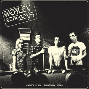 The band standing behind a pool table with a game in progress