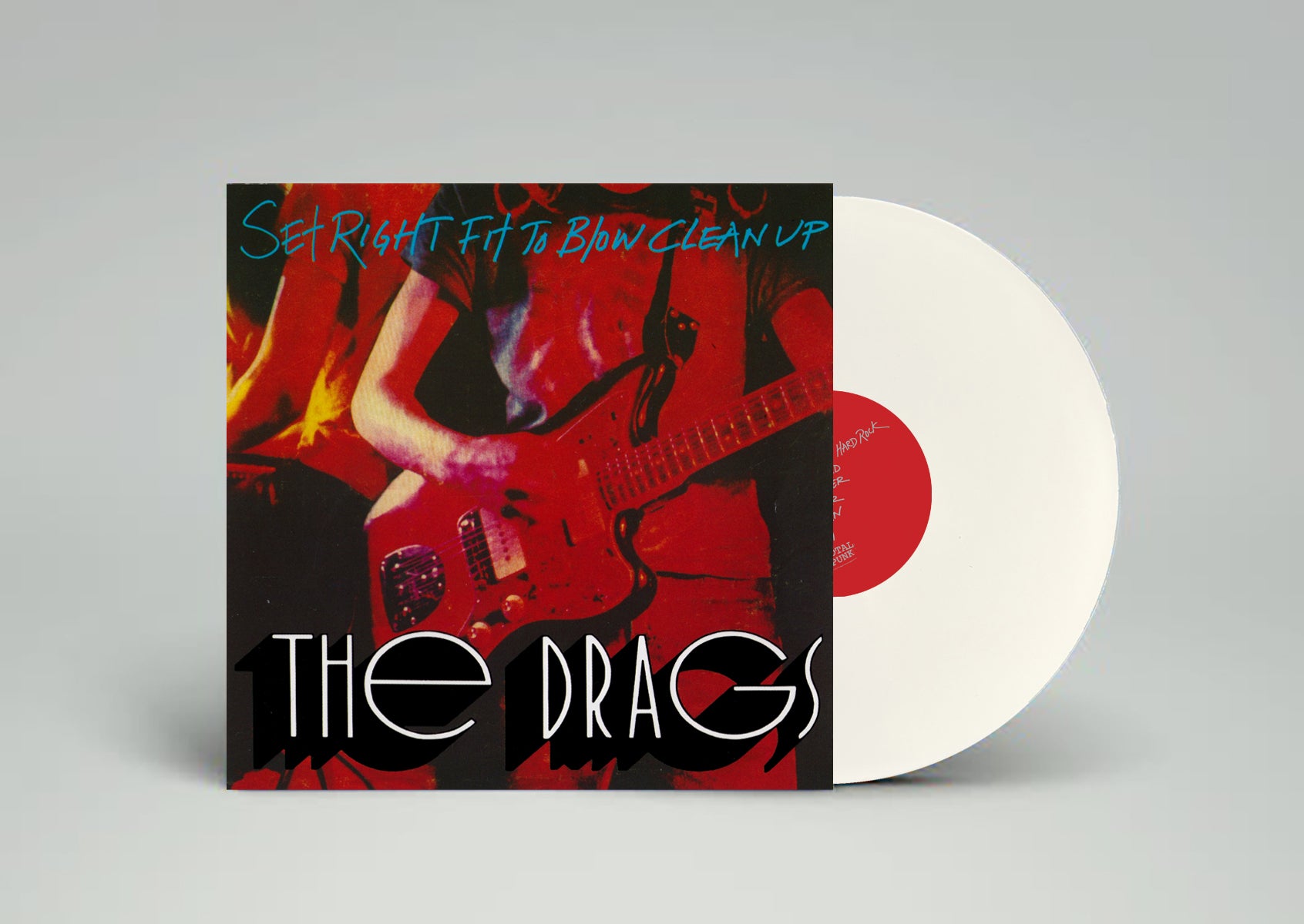 Vinyl record with a colorful cover featuring a person playing guitar on a gray background