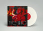 Vinyl record with a colorful cover featuring a person playing guitar on a gray background