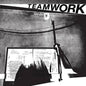Black and white graphic print featuring the word 'TEAMWORK' in bold letters at the top, above a high-contrast abstract scene with a chalkboard, chalk, and handwritten notes.