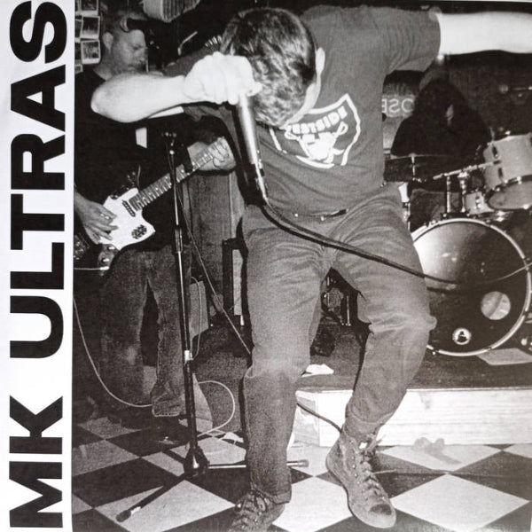 Black and white photo of a band performing with 'MK Ultras' text on the side.