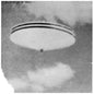 A b/w image of a UFO flying through the clouds